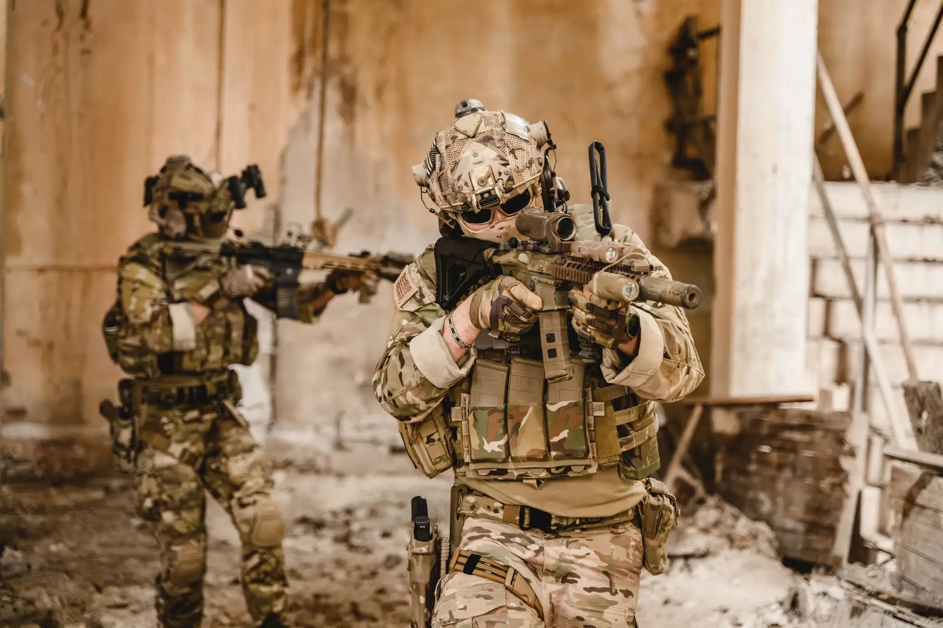 Expert team of soldiers with weapons attacking enemy